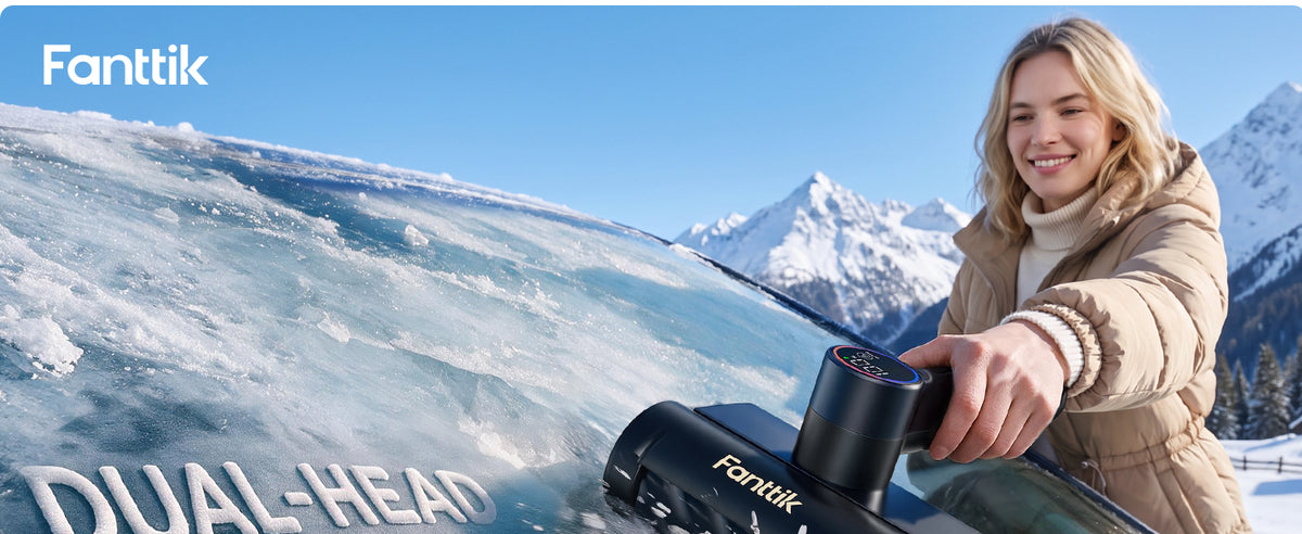 A woman is using a Fantik Polar G10 Max Ice Scraper to defrost her car's windshield.