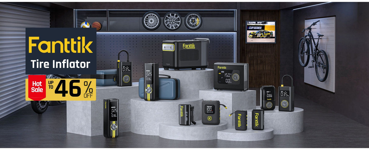 A promotional display of multiple Fanttik Tire Inflator units arranged on white tiered pedestals inside a dark garage-style showroom. A large sale banner on the left reads 'Fanttik Tire Inflator' and 'Hot Sale up to 46% off'.