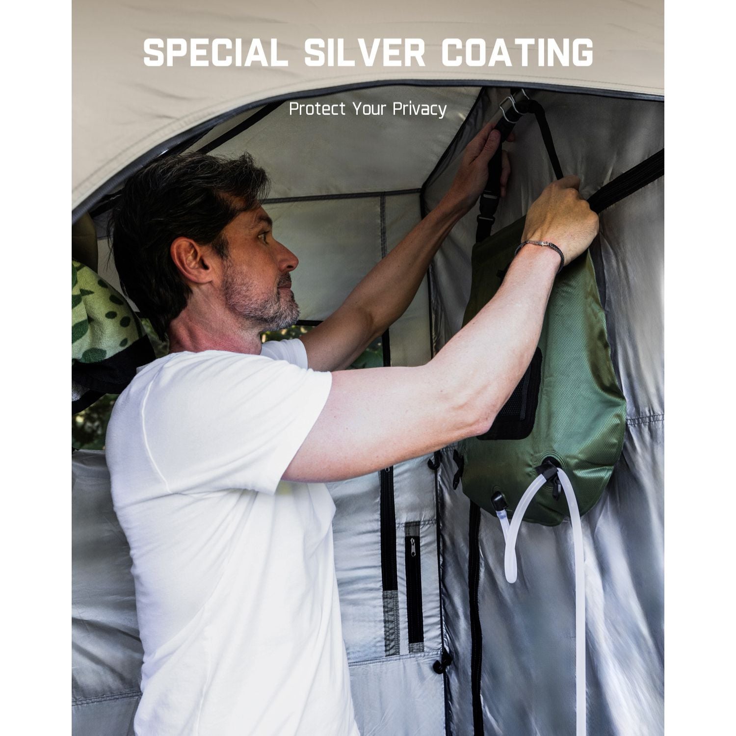 Man hanging shower bag inside FanttikOutdoor Zeta A2 Pro shower tent with special silver coating for privacy.