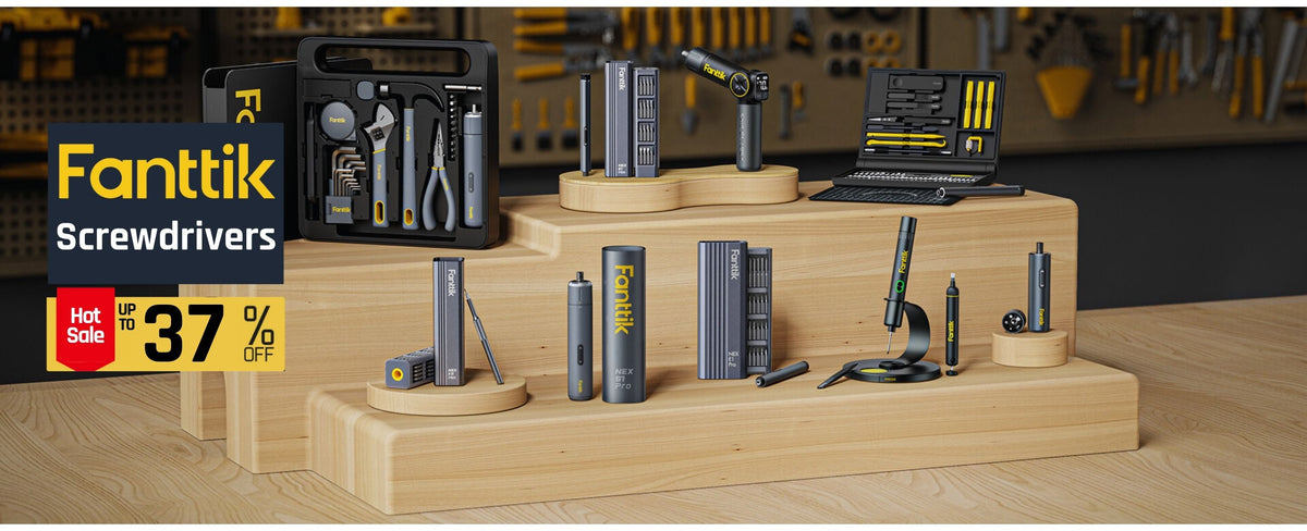 A display of Fanttik Screwdrivers products arranged on wooden pedestals, including a black tool case, a drill, a screwdriver set, and various driver tools, with a yellow and black Fanttik logo overlay on the left.
