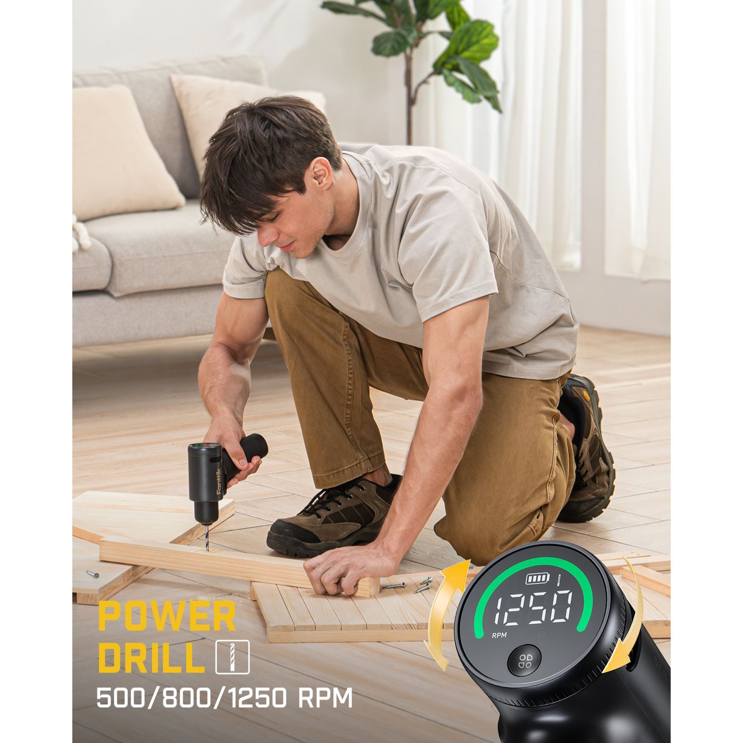 Man using Fanttik K2 Ultra 7.4V cordless power drill with digital RPM display for DIY wood assembly.