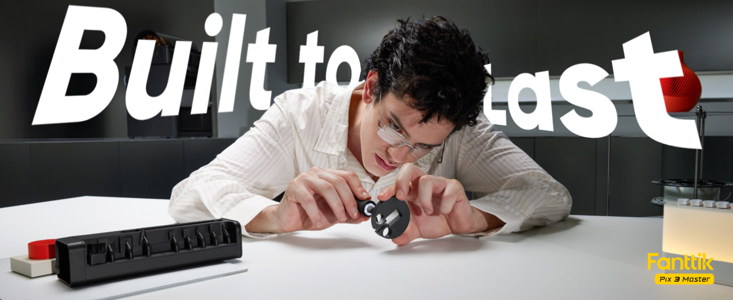 In the image, a man is using a Fanttik Pix 3 Master Electric Detail Sander to sand a small black 3D object on a white table. The background features the words "Durable" in large print, and there is a small yellow "Pix 3 Master" model mark in the lower right corner.