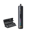 A Fanttik S2 Pro Cordless Electric Screwdriver with a vertical button and colorful LED-style indicator, shown next to an open black battery charger holding multiple battery compartments. The device has the brand name Fanttik printed in yellow near the bottom.