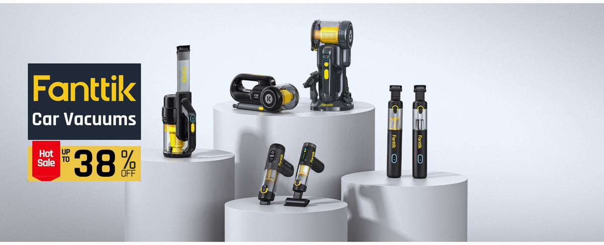 A promotional display of Fanttik Car Vacuums on white cylindrical pedestals against a light gray studio background. Multiple vacuum cleaners in black and yellow are shown in different angles, with a large Fantik logo and sale text overlay on the left.