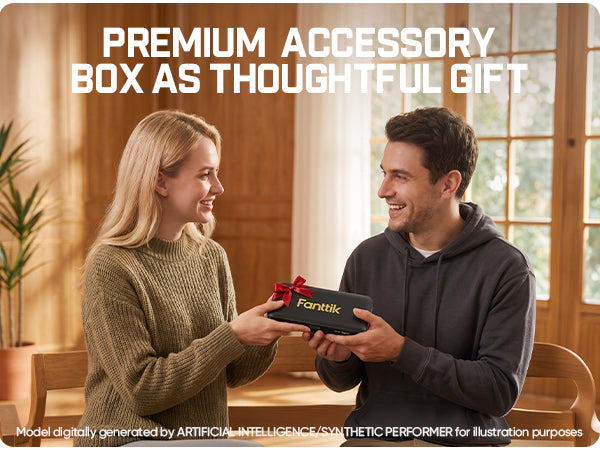 A man and a woman smiling as the woman presents a black Fanttik gift box with a red ribbon to the man in a warm, wood-paneled room. Large white text at the top reads 'PREMIUM ACCESSORY BOX AS THOUGHTFUL GIFT'.