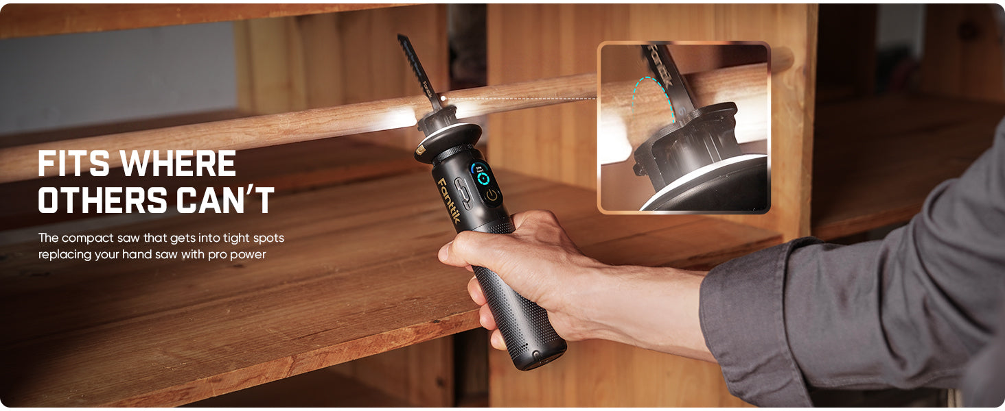 A person holds a compact cordless saw with a built-in LED light under a wooden shelf. The image includes marketing text reading 'FITS WHERE OTHERS CAN'T' and a small inset showing the screwdriver tip in close-up.